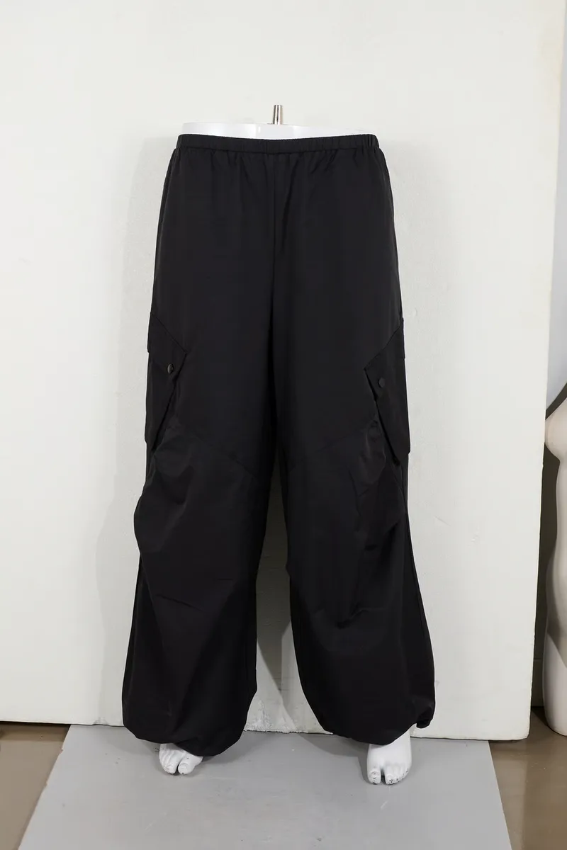Black cargo trousers on a lower-body mannequin form