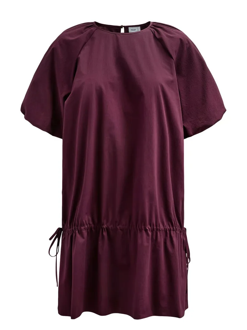 A burgundy short-sleeved dress with puff sleeves and a gathered drop waist, shot as an invisible-mannequin packshot on a plain background